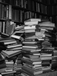 Stacks of dusty books black and white